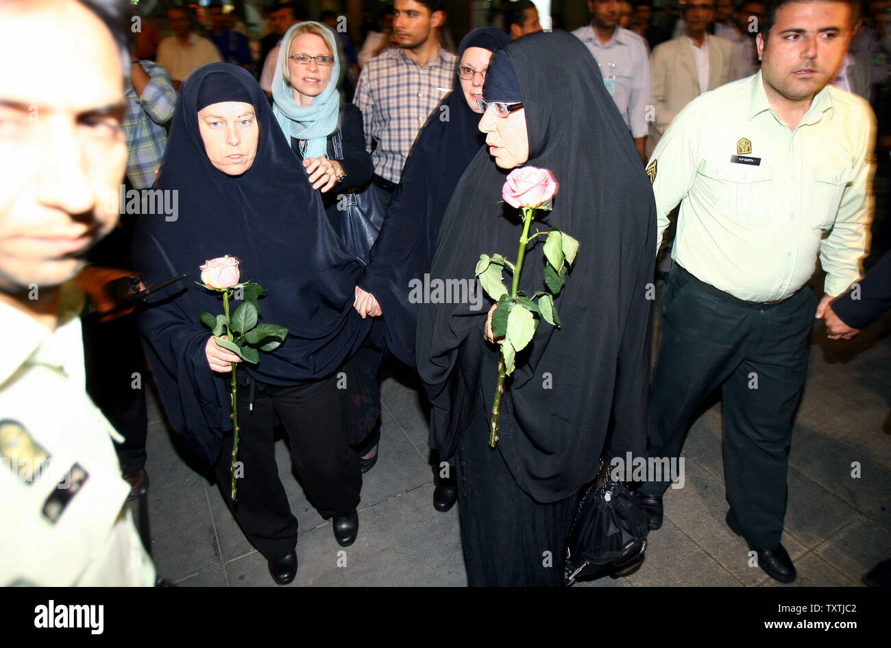 Cindy Hickey (L-R), Nora Shroud, and Laura Fattal walk with Swiss Ambassador to Iran Livia Leu Agosti, (blue hijab) at Imam Khomeini Airport in Tehran, Iran on May 19, 2010 after arriving to visit their children. Shane Bauer, 27, Sarah Shourd, 31, and Josh Fattal, 27, were detained on July 31,2009 after straying across Iran's border while on a hiking trip in northern Iraq's Kurdistan region.       UPI/Maryam Rahmanian Stock Photo