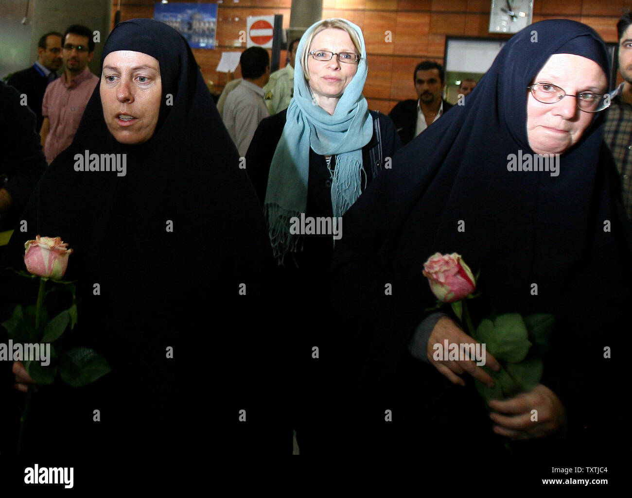 Cindy Hickey (L), and Nora Shroud (R), walk with Swiss ambassador to Iran Livia Leu Agosti, (C) at Imam Khomeini Airport in Tehran, Iran on May 19, 2010 to visit their children. Shane Bauer, 27, Sarah Shourd, 31, and Josh Fattal, 27, were detained on July 31,2009 after straying across Iran's border while on a hiking trip in northern Iraq's Kurdistan region.       UPI/Maryam Rahmanian Stock Photo