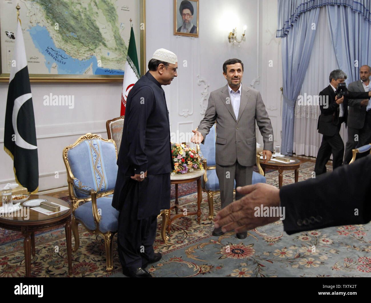 Iranian President Mahmoud Ahmadinejad (R) greets his Pakistani counterpart Asif Ali Zardari (L) in the presidential palace on June 24, 2011 in Tehran. Zardari  scheduled to participate in the Global Fight against Terrorism International Summit which will be held on June 25 and 26 in Tehran.     UPI/Maryam Rahmanian Stock Photo