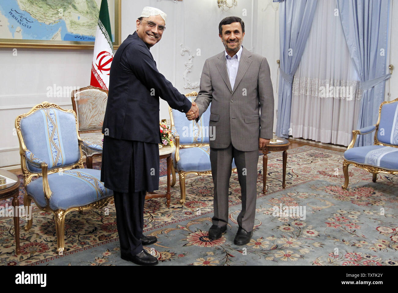 Iranian President Mahmoud Ahmadinejad (R) shakes hands with his Pakistani counterpart Asif Ali Zardari in the presidential palace on June 24, 2011 in Tehran. Zardari  scheduled to participate in the Global Fight against Terrorism International Summit which will be held on June 25 and 26 in Tehran.     UPI/Maryam Rahmanian Stock Photo