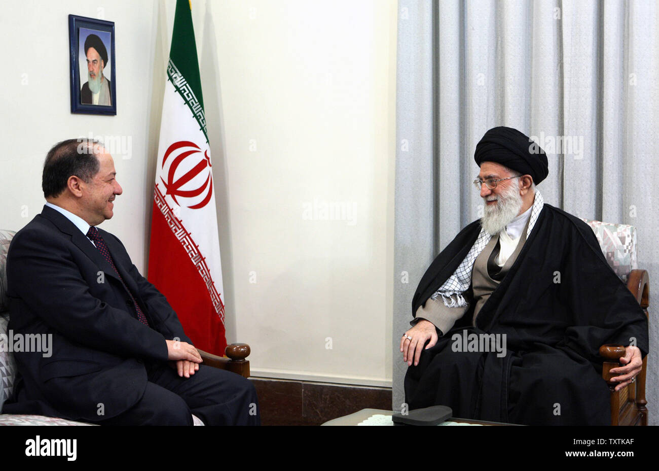Iran's supreme Leader Ayatollah Khamenei (R) meets with  Masoud Barzani the head of the autonomous Kurdish region in Iraq, during their official meeting in presidential palace in Tehran, Iran on Oct 30,2011.     UPI/Khamenei Hand Out Image Stock Photo