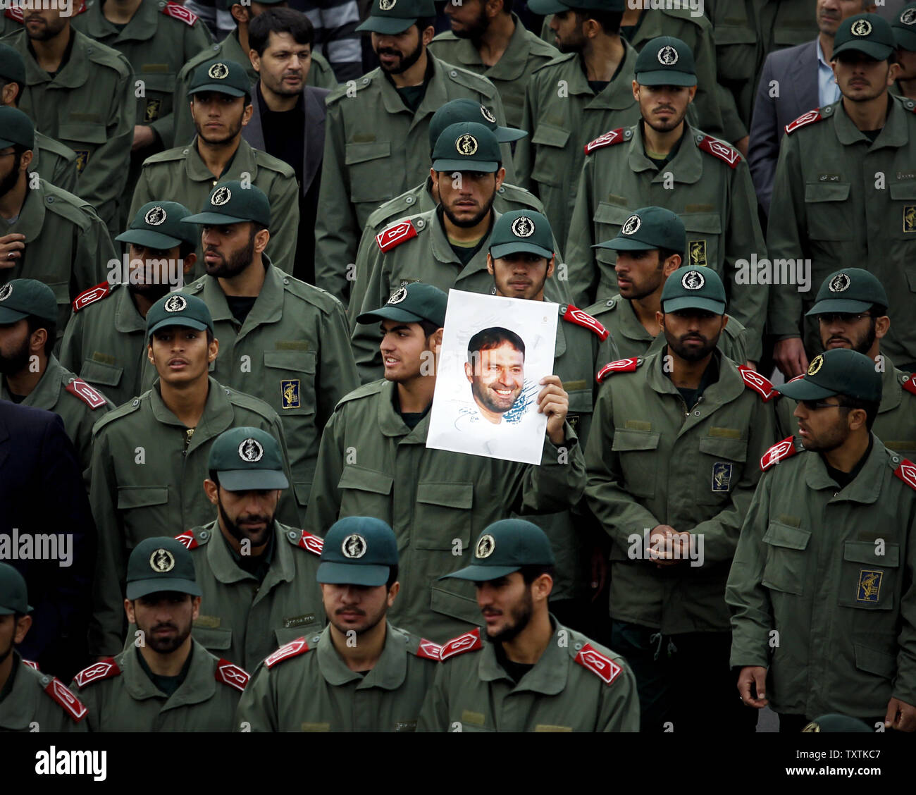 Iranians mourn for Revolutionary Guard soldiers who killed during explosion in Tehran, Iran, November 14, 2011.The explosion happened on on Saturday when  a munitions depot caught fire at the IRGC base in Bidgeneh village. The Total of 17 IRGC forces, including Maj. Gen. Hassan Tehrani Moqaddam, director of the Guard's Jihad Self-Sufficiency Organization were killed and 16 others were seriously injured. Tehran, Iran , November 14, 2011.     UPI/Maryam Rahmanian. Stock Photo