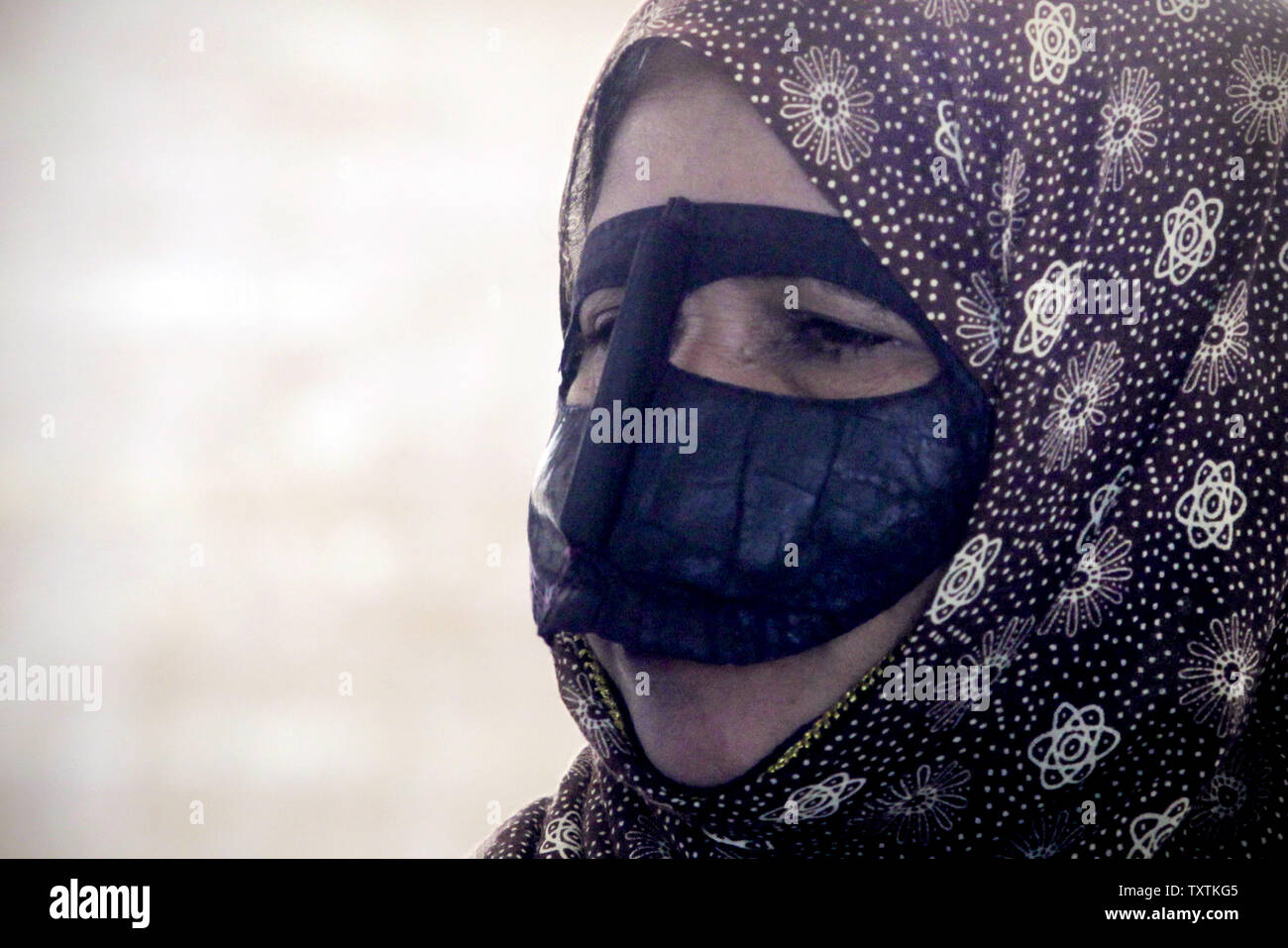 An Iranian woman wears traditional burqa in Qeshm Island on Dec 24, 2011. Qeshm Island is located at southern part of Iran in the Hormoz Strait.     UPI/Maryam Rahmanian Stock Photo