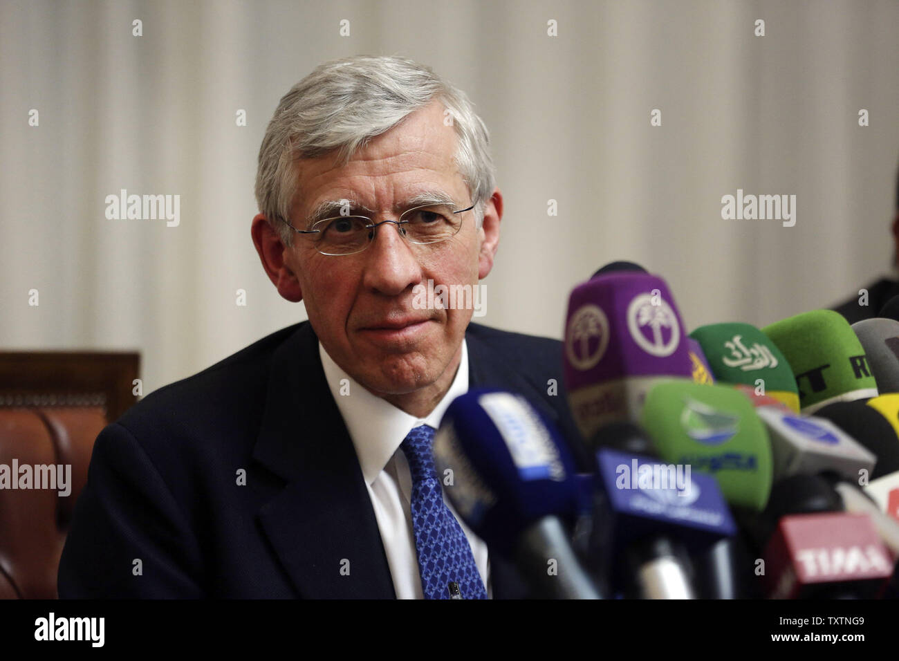 Former British Foreign Secretary Jack Straw listens to the questions of