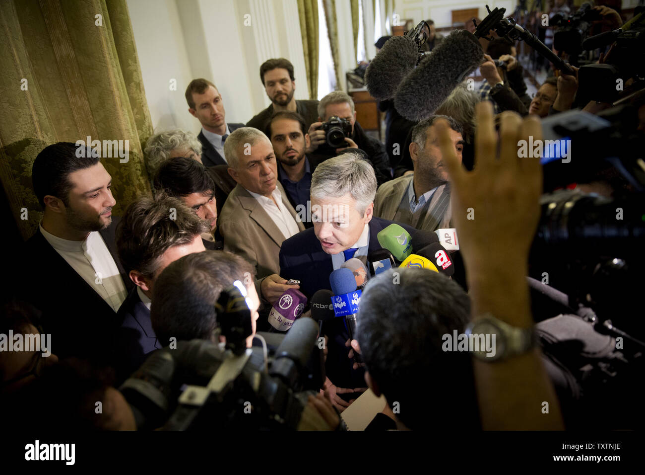 Belgian Foreign Minister Didier Reynders answers questions from reporters after his joint press conference with Iranian FM Mohammad Javad Zarif (not pictured) at the Iranian foreign ministry in Tehran, Iran on February 23, 2014. Reynders is the third foreign minister from the European Union to visit Iran in the past two months.     UPI/Maryam Rahmanian Stock Photo