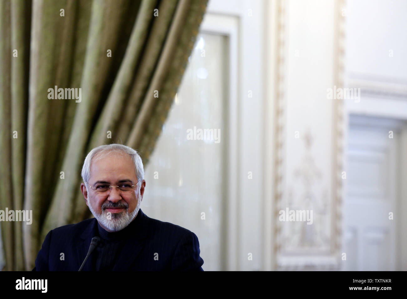 Iranian FM Mohammad Javad Zarif listens to a question during a joint press conference with Evangelos Venizelos, the Greek foreign minister (not pictured), at Iranian Foreign ministry in Tehran,Iran on March 15, 2014. Venizelos is scheduled to hold talks with other Iranian officials to discuss ways of expansion of bilateral ties between Athens and Tehran.     UPI/Maryam Rahmanian Stock Photo