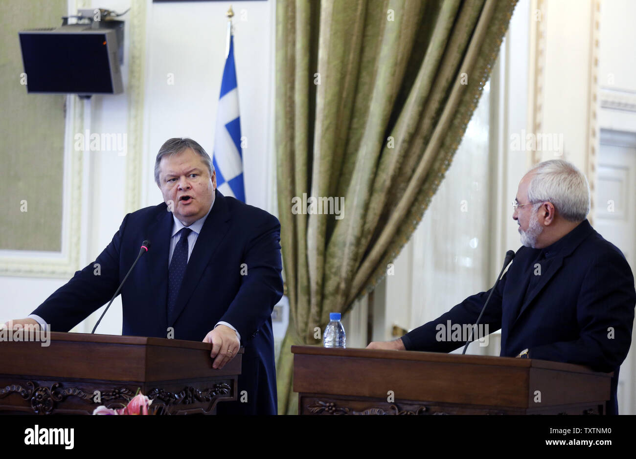 Evangelos Venizelos, Greek foreign minister (L) speaks as Iranian FM Mohammad Javad Zarif (R) looks on during their joint press conference at Iranian Foreign ministry in Tehran, Iran on March 15, 2014. Venizelos is also scheduled to hold talks with other Iranian officials to discuss ways of expansion of bilateral ties between Athens and Tehran.     UPI/Maryam Rahmanian Stock Photo