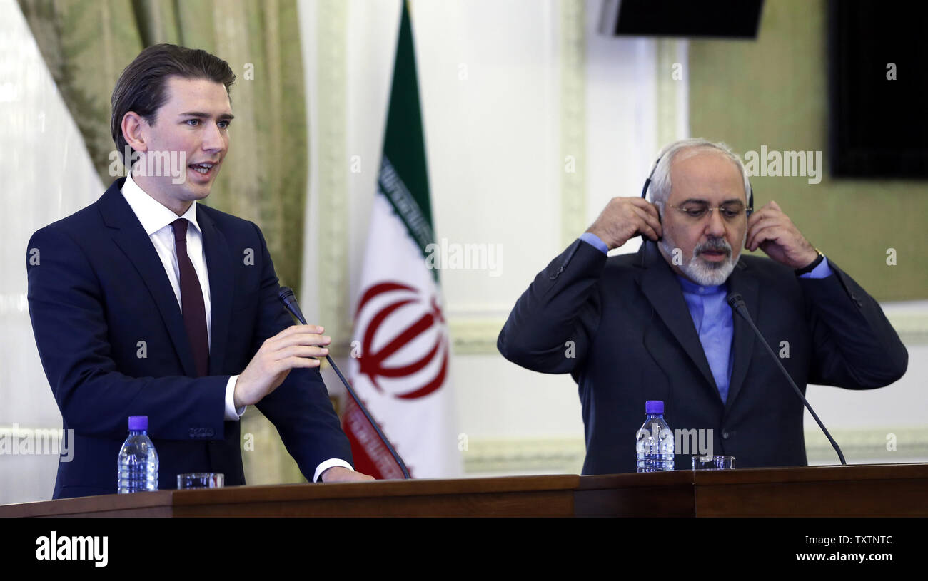 Iranian Foreign Minister Mohamad Javad Zarif  (R) shakes hands with his Austrian counterpart Sebastian Kurz (L) after their joint press conference  in Tehran, Iran, April 27, 2014. Austria’s President Heinz Fischer is expected to pay a visit to Iran in the near future, first head of a western state to visit Iran for many years.      UPI/Maryam Rahmanian Stock Photo