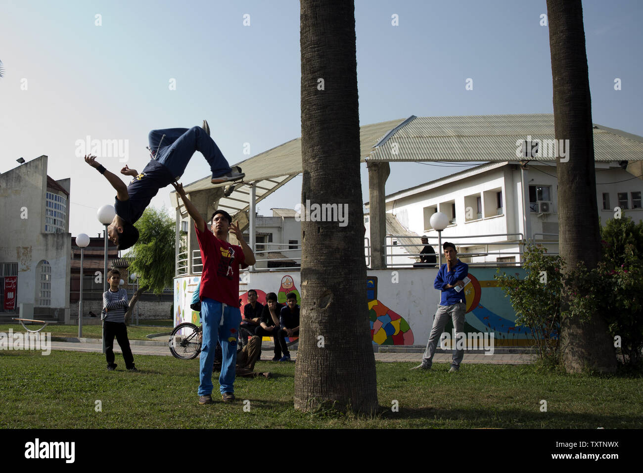 Iranian teens practice Parkour, an urban French training discipline, at a park in Sari ,the provincial capital of Mazandaran province in the north of Iran, May 24, 2014. During last couple of years, Parkour has been a popular trend among Iranian youth.     UPI/Maryam Rahmanian Stock Photo