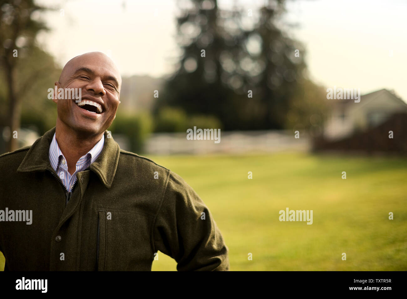 Mid adult man standing hi-res stock photography and images - Alamy