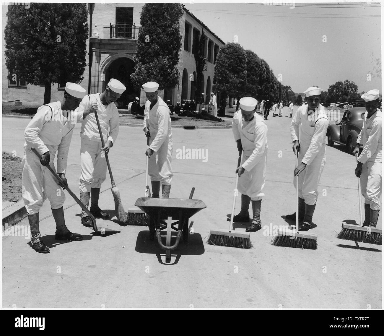 [Six sailors sweeping sidewalks at Naval Training Center, San Diego
