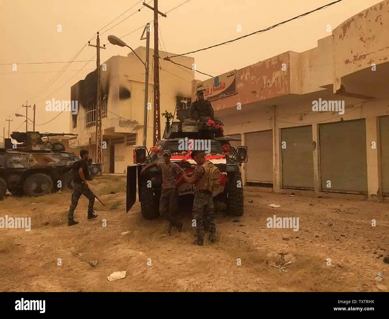 Iraqi government forces are seen after recapturing the town Zankoura from the Islamic State (IS) jihadist group, northwest of Ramadi, in Anbar province, Iraq on June 16, 2016. Retaking the area around Zankoura was an attempt by IS to distract Iraqi forces in Anbar province, where a big battle to retake Fallujah is going on.      Photo by Abbas Mohammed /UPI Stock Photo