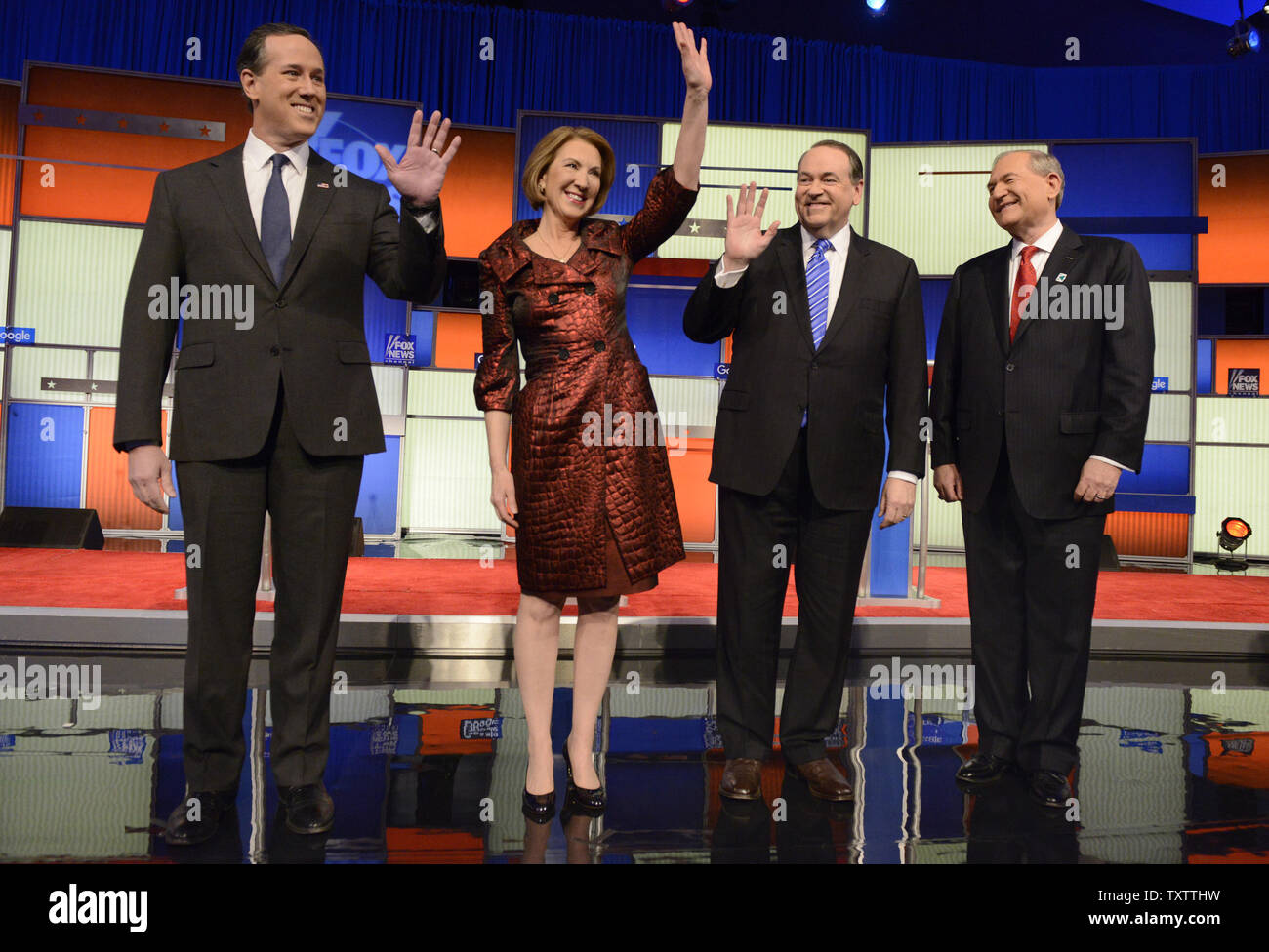 2016 Republican presidential candidates (L-R) former Pennsylvania Sen. Rick Santorum, business woman Carly Fiorina, former Arkansas Gov. Mike Huckabee and former Virginia Gov. Jim Gilmore arrive onstage as the undercard of a GOP debate hosted by Fox News, January 28, 2016, in Des Moines, Iowa. The debate is the final one before Iowa's first-in-the-nation caucuses, February 1.      Photo by Mike Theiler/UPI Stock Photo