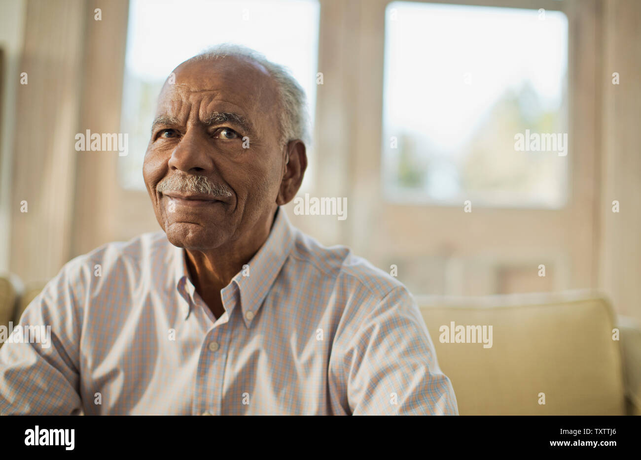 Portrait of a content senior man. Stock Photo