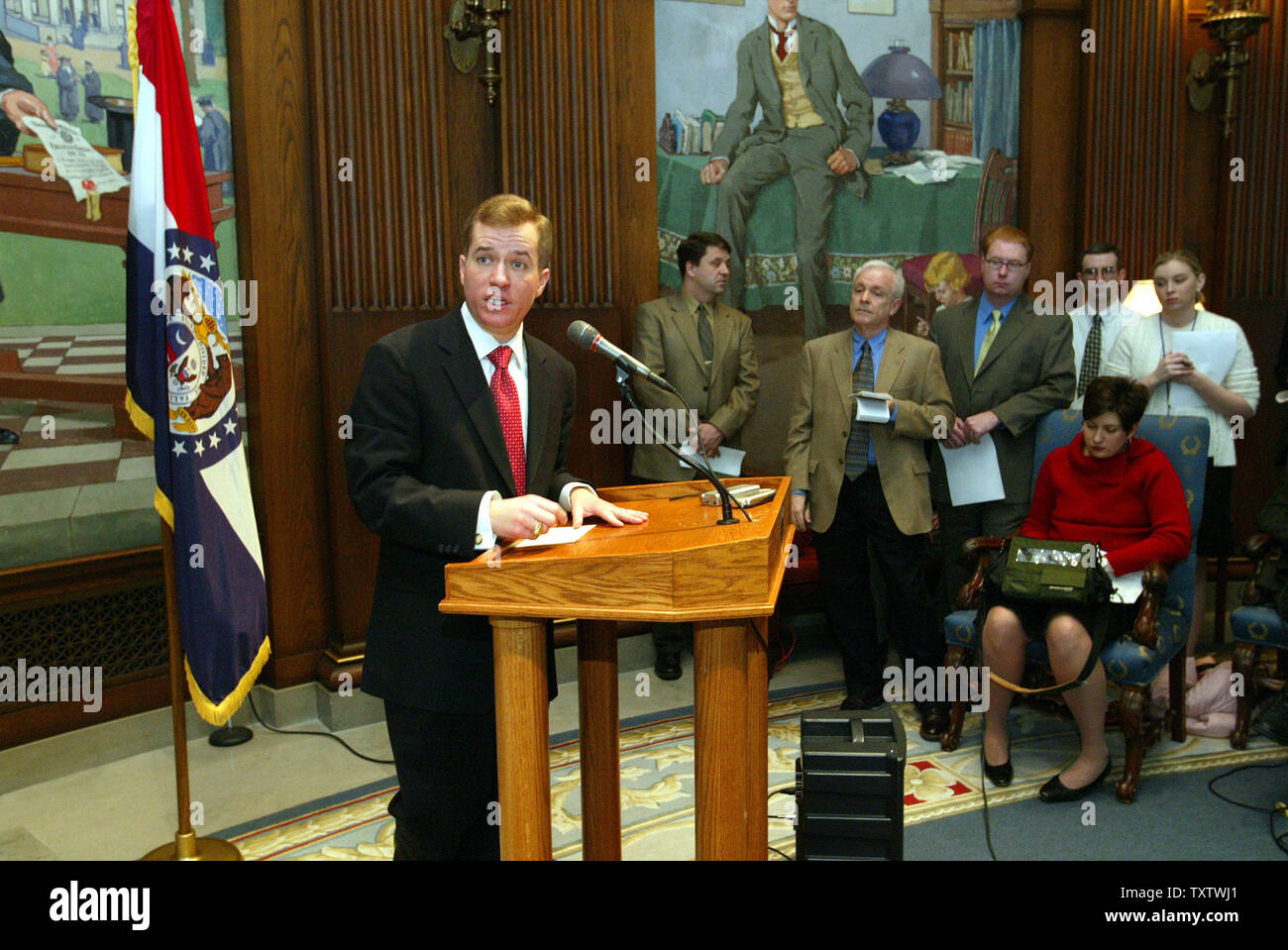 Mo. Gov. Matt Blunt answers a reporters question on his first full day at work in the State Capitol in Jefferson City, Mo on January 11, 2005. Blunt also announced the revocation of former Gov. Bob Holden's executive order which sanctioned collective bargaining for state agencies which sought to allow service unions to take money out of the paychecks of state workers. Blunt also announced cost-cutting measures like the closing of the state's Washington, D.C. office, a freeze on the purchase of non-emergency vehicles, cell phones and the purchase and leasing of new office space for state agenci Stock Photo