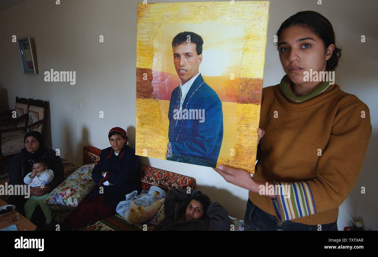 Sara Suwaid holds a photo of her brother, kidnapped Israeli soldier, Omar Suwaid, at his home in the Bedouin village Salama in northern Israel, January 27, 2004. Omar was kidnapped in October 2000, with two soldiers whose bodies will be returned to Israel in a controversial  prisoner swap brokered by Germany. Israel will receive the bodies of three slain Israeli soldiers and an Israeli businessman in exchange for releasing 59 bodies of Hizbollah fighters and more than 400 Arab prisoners. (UPI Photo/Debbie Hill) Stock Photo