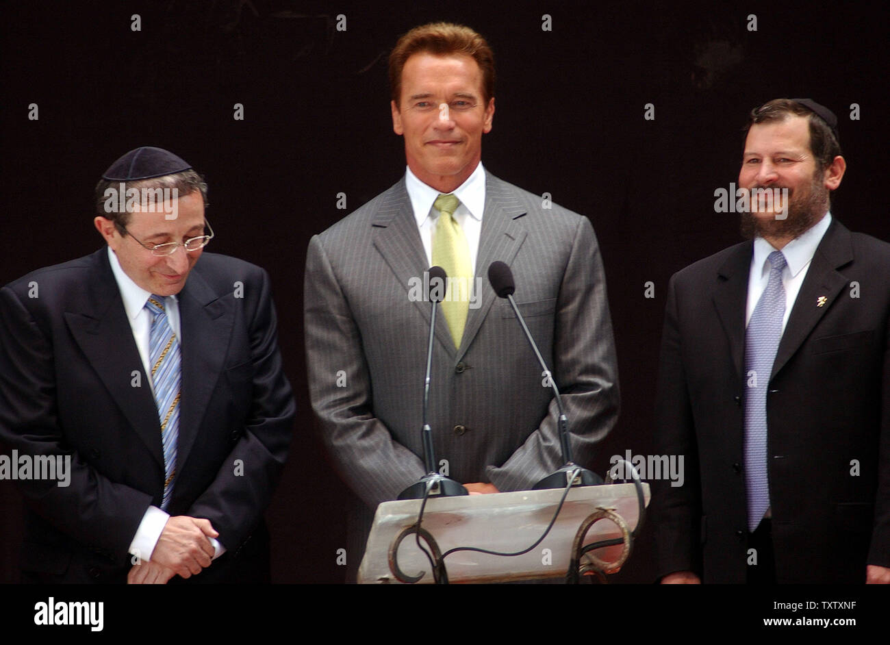 California Governor Arnold Schwarzenegger, center, stands with left