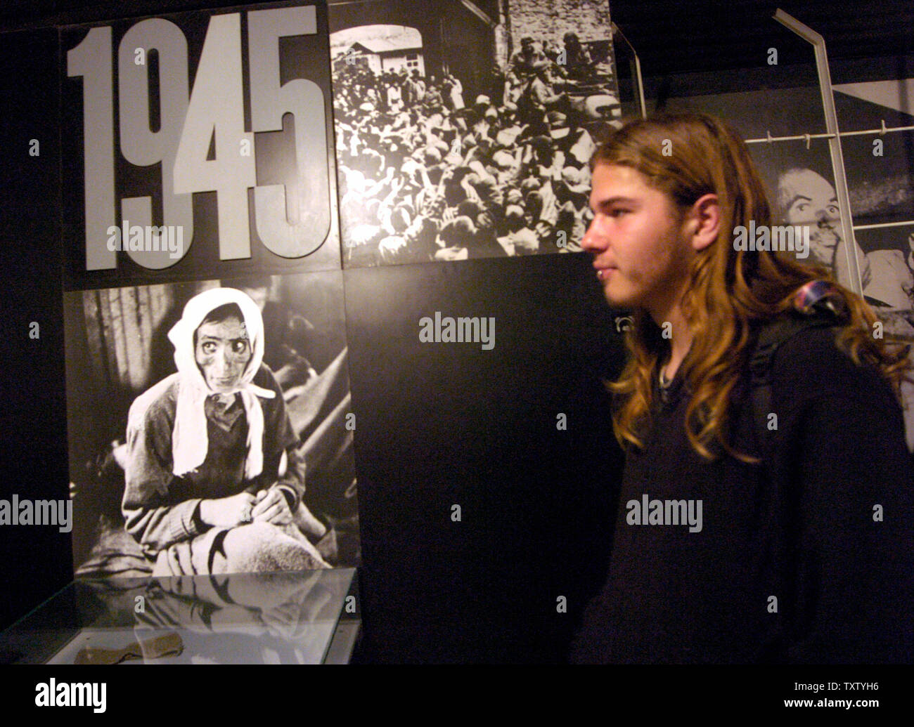 An Israeli teen visits an exhibit in Yad Vashem, the Holocaust Museum in Jerusalem, January 24, 2005. The UN will hold  a special session, today, of the General Assembly to commemorate the 60th anniversary of the liberation of the Nazi death camp at Auschwitz, which happened on Jan. 27., 1945.    (UPI Photo/Debbie Hill) Stock Photo