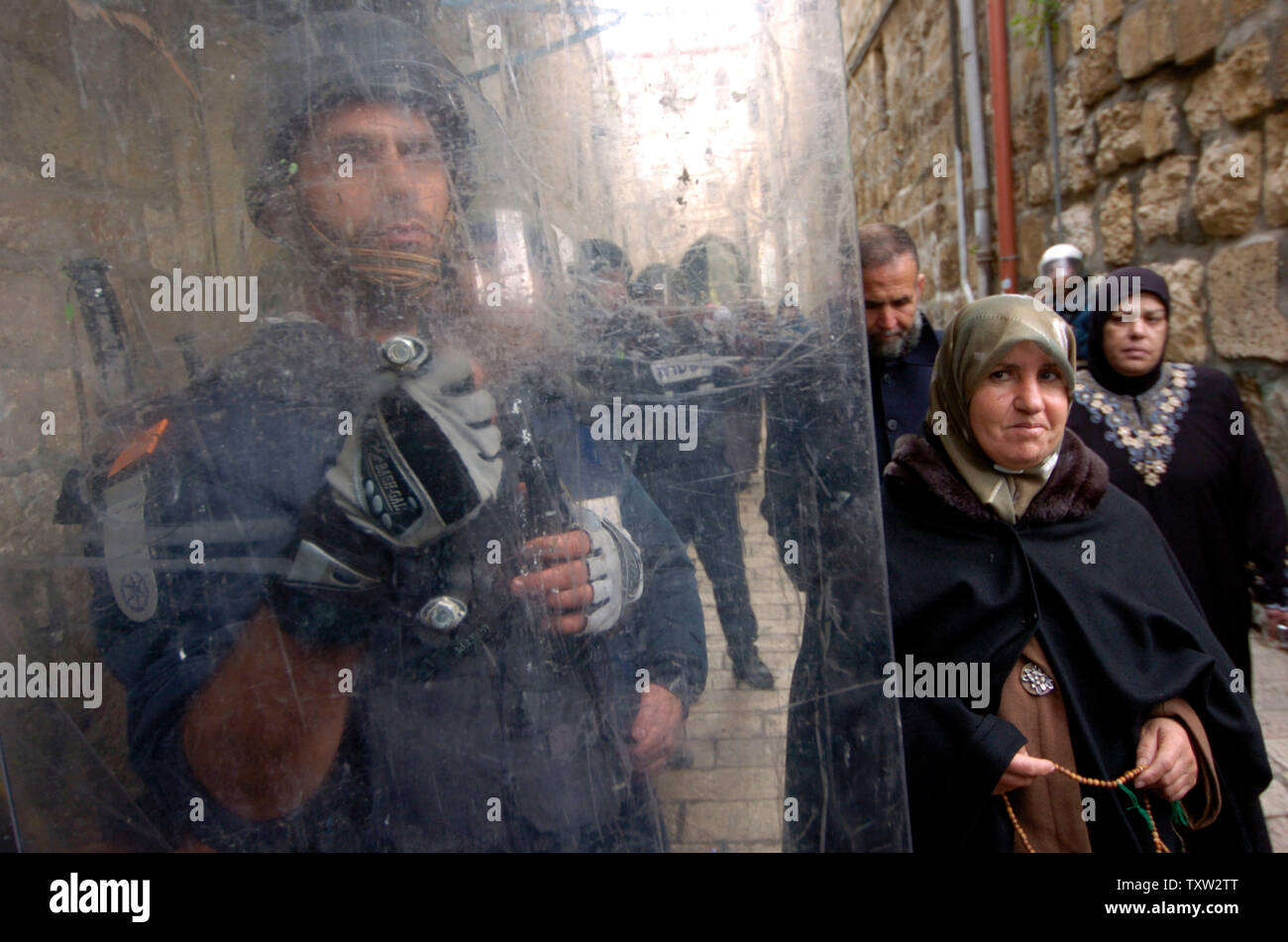 An Israeli riot police officer holds a shield outside the Al-Aqsa ...