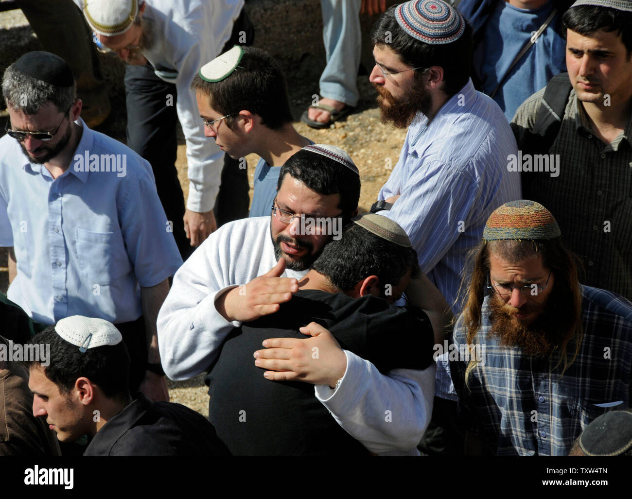 Israeli mourn at the funeral of Segev Avihayil, 15, on the Mt. of Olives in Jerusalem, March 7, 2008. Avihayil was one of eight yeshiva students killed Thursday night in a shooting attack by a Palestinian at the Mercaz Harav Yeshiva in Jerusalem.  (UPI Photo/Debbie Hill) Stock Photo