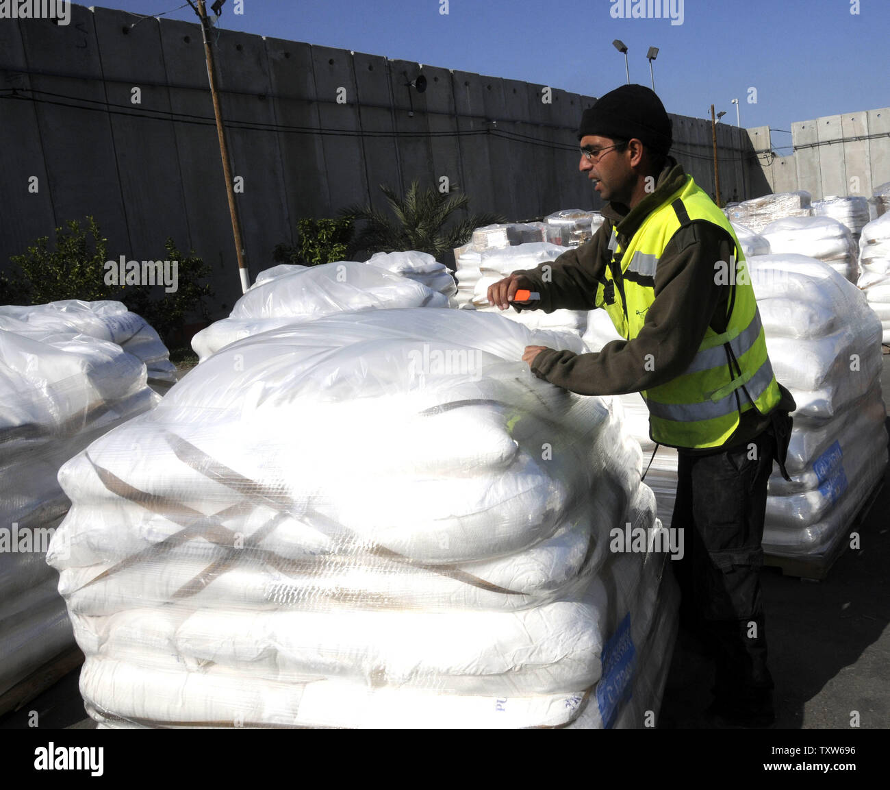 A worker checks humanitarian aid consisting of medical supplies, food