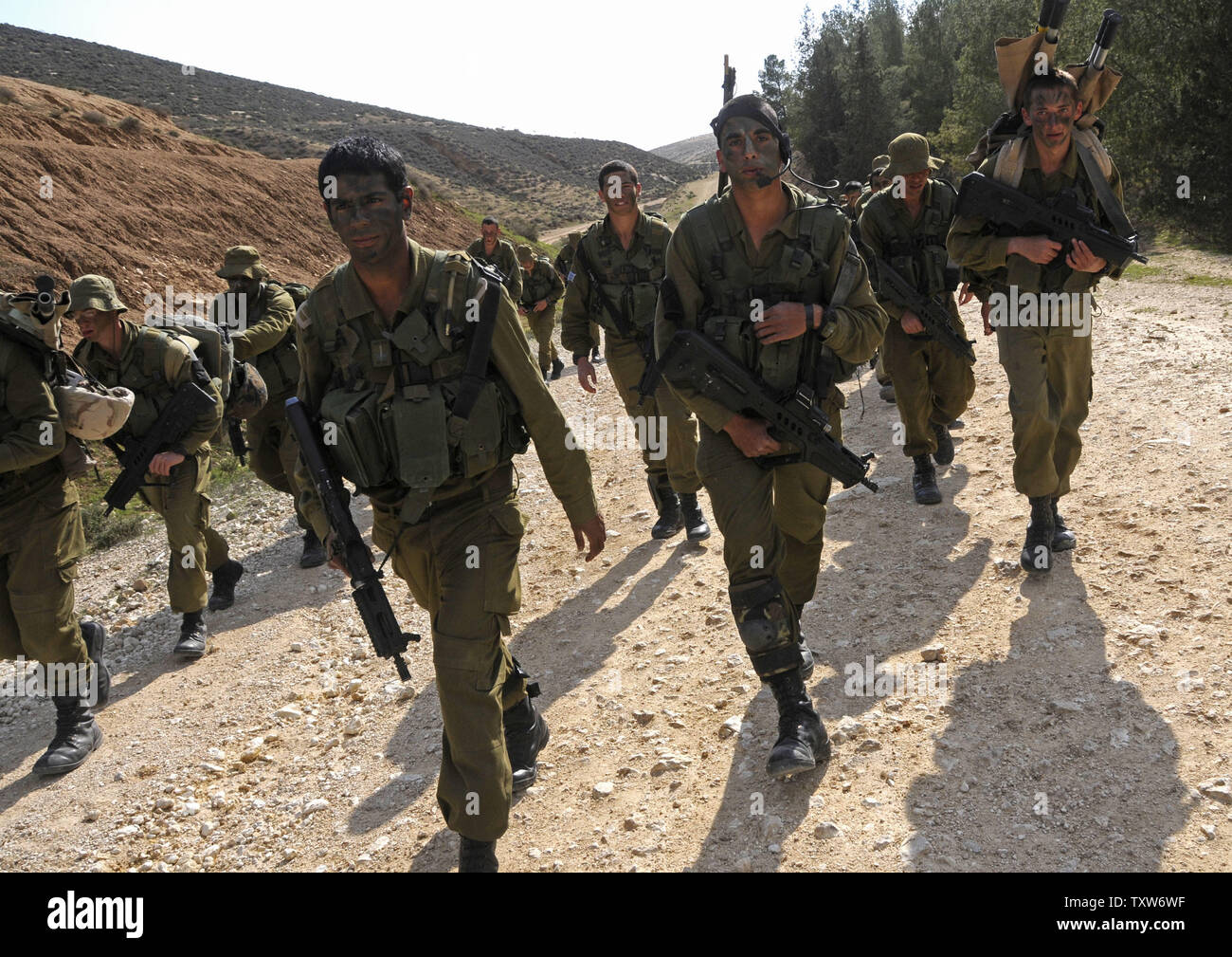 Israeli soldiers from the Givati Brigade walk the sixty kilometer beret march from Beit Haya'aran to Masada, March 25, 2009. The Givati Brigade, a combat unit in the Israeli Defense Force, played a significant role in operation Cast Lead in Gaza.(UPI Photo/Debbie Hill) Stock Photo