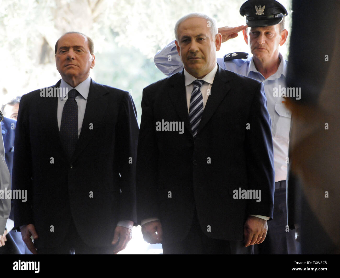 L-R:  Italian Prime Minister Silvio Berlusconi and Israeli Prime Minister Benjamin Netanyahu walk by a honor guard at a welcoming ceremony at Netanyahu's Jerusalem office, February 1, 2010. Prime Minister Berlusconi is in Israel for a three- day visit.   UPI/Debbie Hill Stock Photo