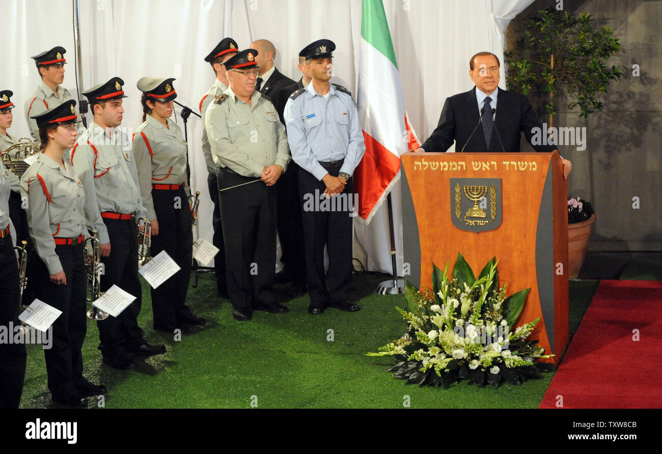Italian Prime Minister Silvio Berlusconi speaks beside an Israeli military bank at a welcoming ceremony at Israeli Prime Minister Benjamin Netanyahu's Jerusalem office, February 1, 2010. Prime Minister Berlusconi is in Israel for a three- day visit.   UPI/Debbie Hill Stock Photo