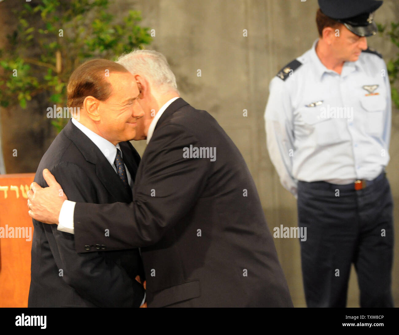 L-R:  Italian Prime Minister Silvio Berlusconi hugs Israeli Prime Minister Benjamin Netanyahu during a welcoming ceremony at Netanyahu's Jerusalem office, February 1, 2010. Prime Minister Berlusconi is in Israel for a three- day visit.   UPI/Debbie Hill Stock Photo