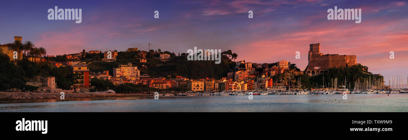 LERICI, LIGURIA, ITALY – JUNE 24, 2019: Panorama landscape view with boats, sea and old castle against great sunset sky. Stock Photo