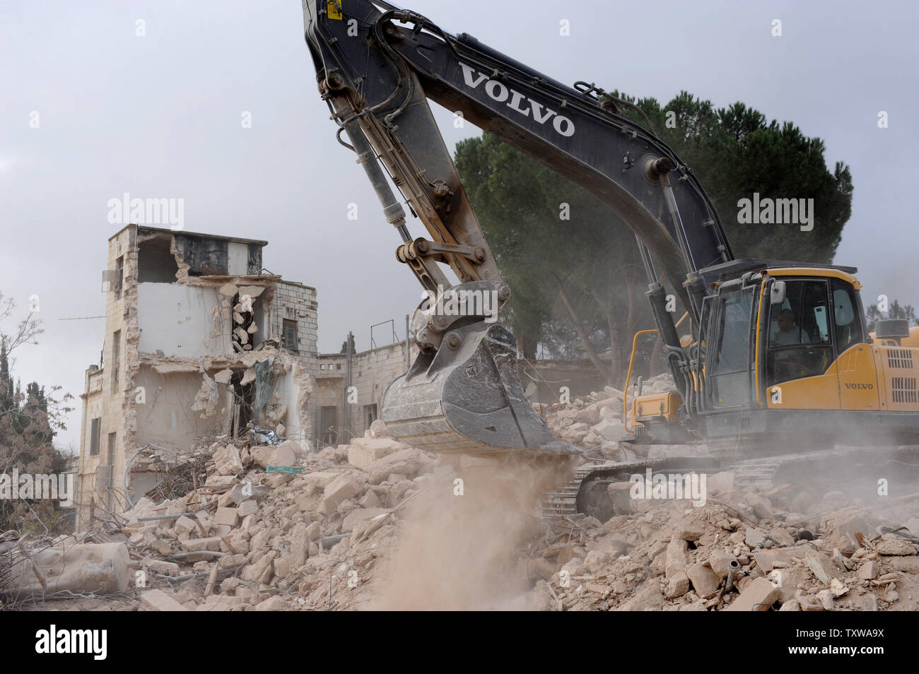 Israeli bulldozers demolish the Shepherd Hotel in the East Jerusalem ...