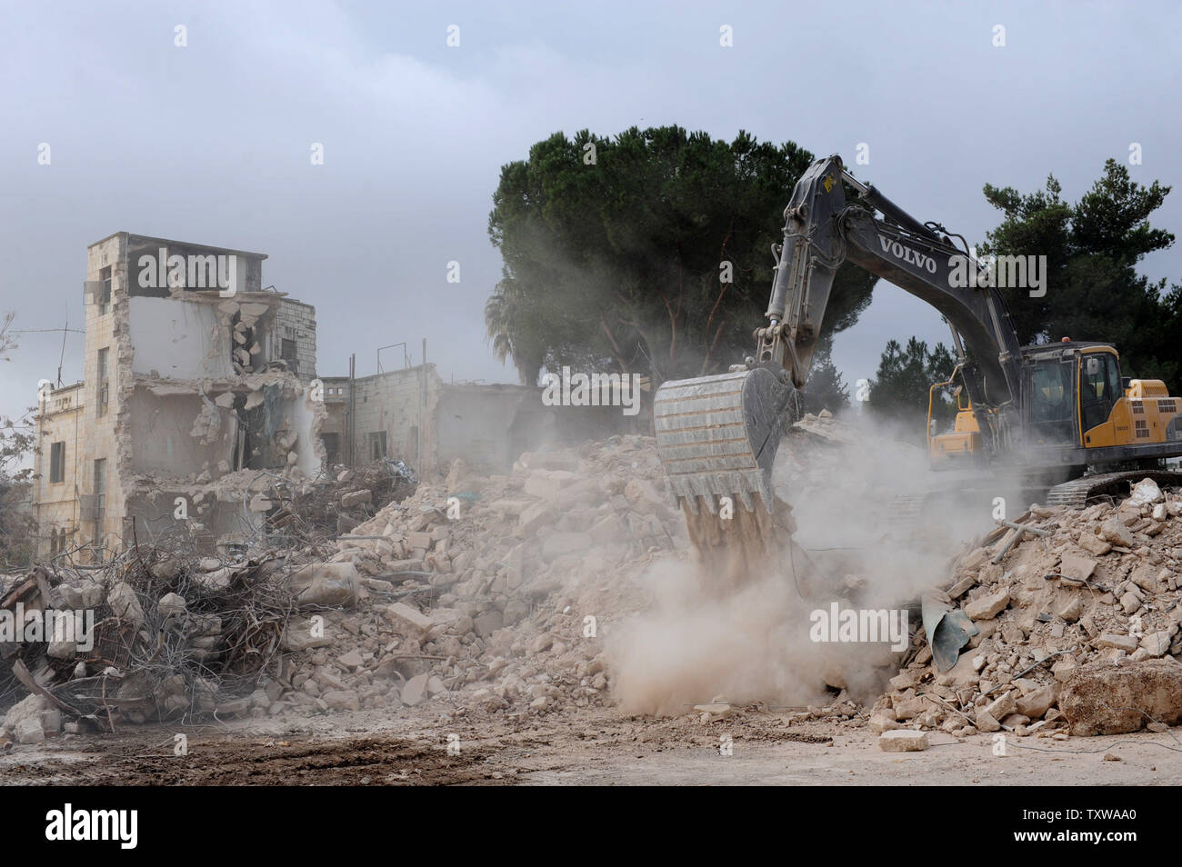Israeli bulldozers demolish the Shepherd Hotel in the East Jerusalem ...