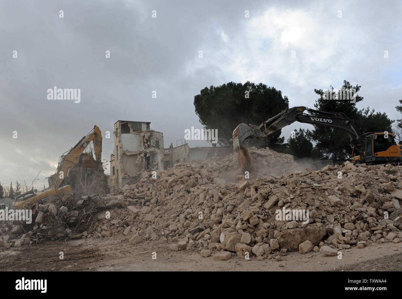 Israeli bulldozers demolish the Shepherd Hotel in the East Jerusalem ...
