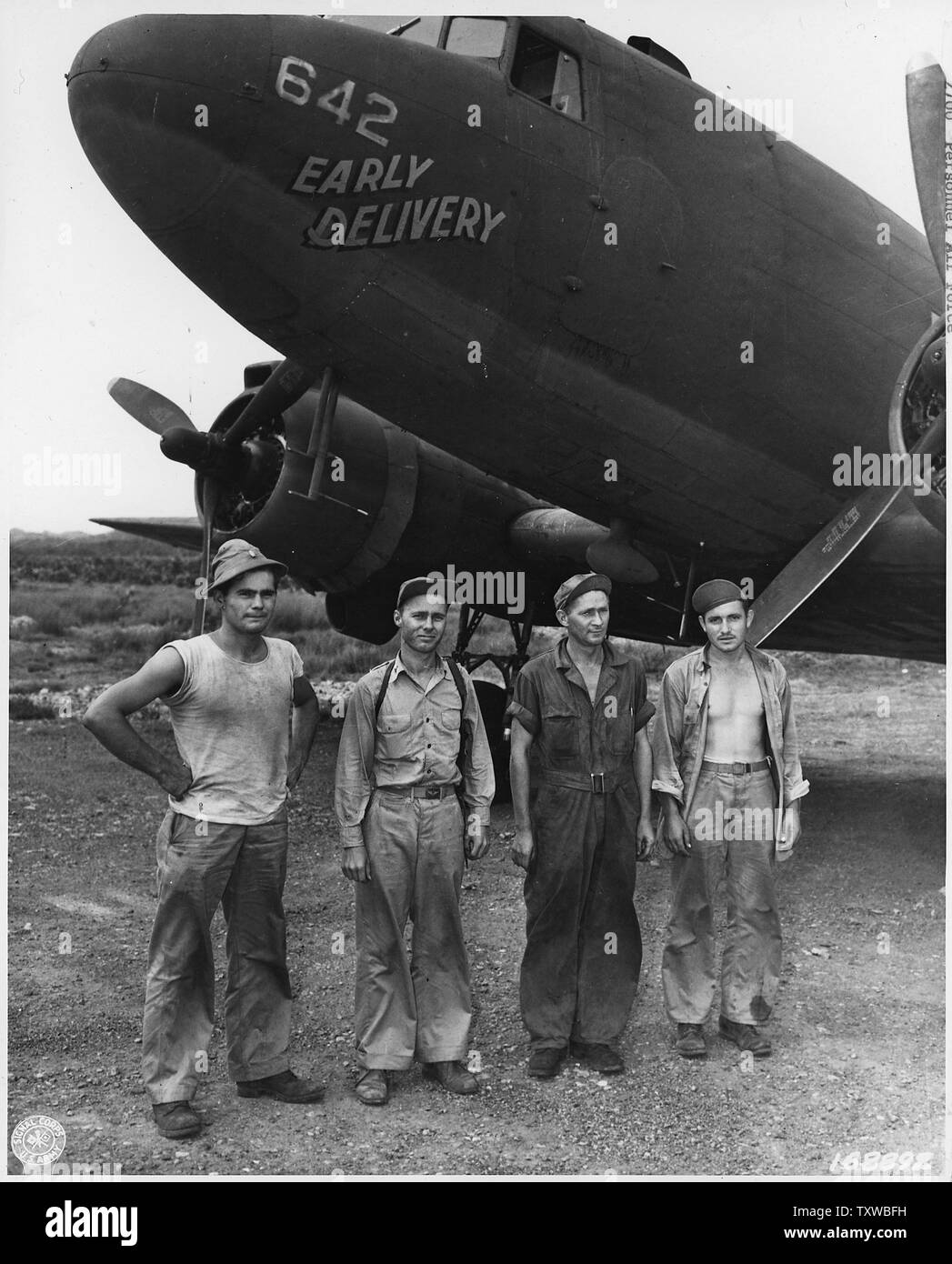 Air Force personnel & equipment. The Pacific, England, Wash. DC. 1942-44 (mostly 1943); Scope and content:  Crew of the Early Delivery that supply the ground forces in New Guinea with equipment and foodstuffs. They are members of the Troop Carrier Group. 2nd. Lt. Preston Holden, pilot, of West Union, West Va.; 2nd Lt. John W. Foltz, pilot of Lima, Ohio; Cpl. Emil W. Erickson, engineer, of Middle River, Minn.; and Pvt. Clifford C. Fawn, radio operator, of Lewis Center, Ohio. Stock Photo