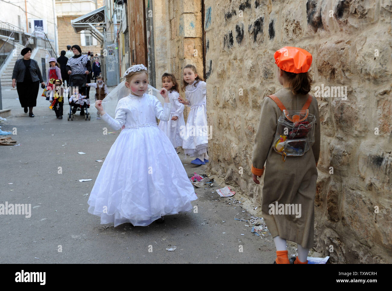 An Ultra-Orthodox Jewish girl, dressed as Queen Esther, celebrates  the Jewish holiday of Purim in the Mea Shearim neighborhood in Jerusalem, March 9, 2012. The festival of Purim commemorates the rescue of Jews from genocide in ancient Persia as told in the book of Esther.  UPI/Debbie Hill Stock Photo