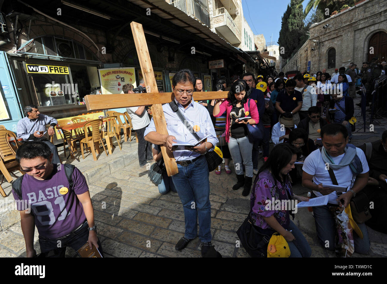 Christian Pilgrims Carry A Cross On The Via Dolorosa The Way Of