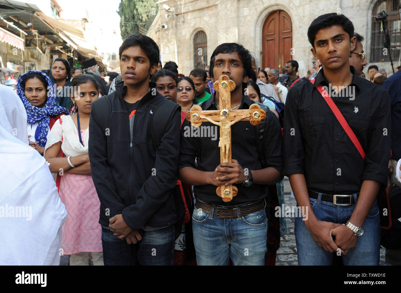 Christian Pilgrims Carry A Cross On The Via Dolorosa The Way Of