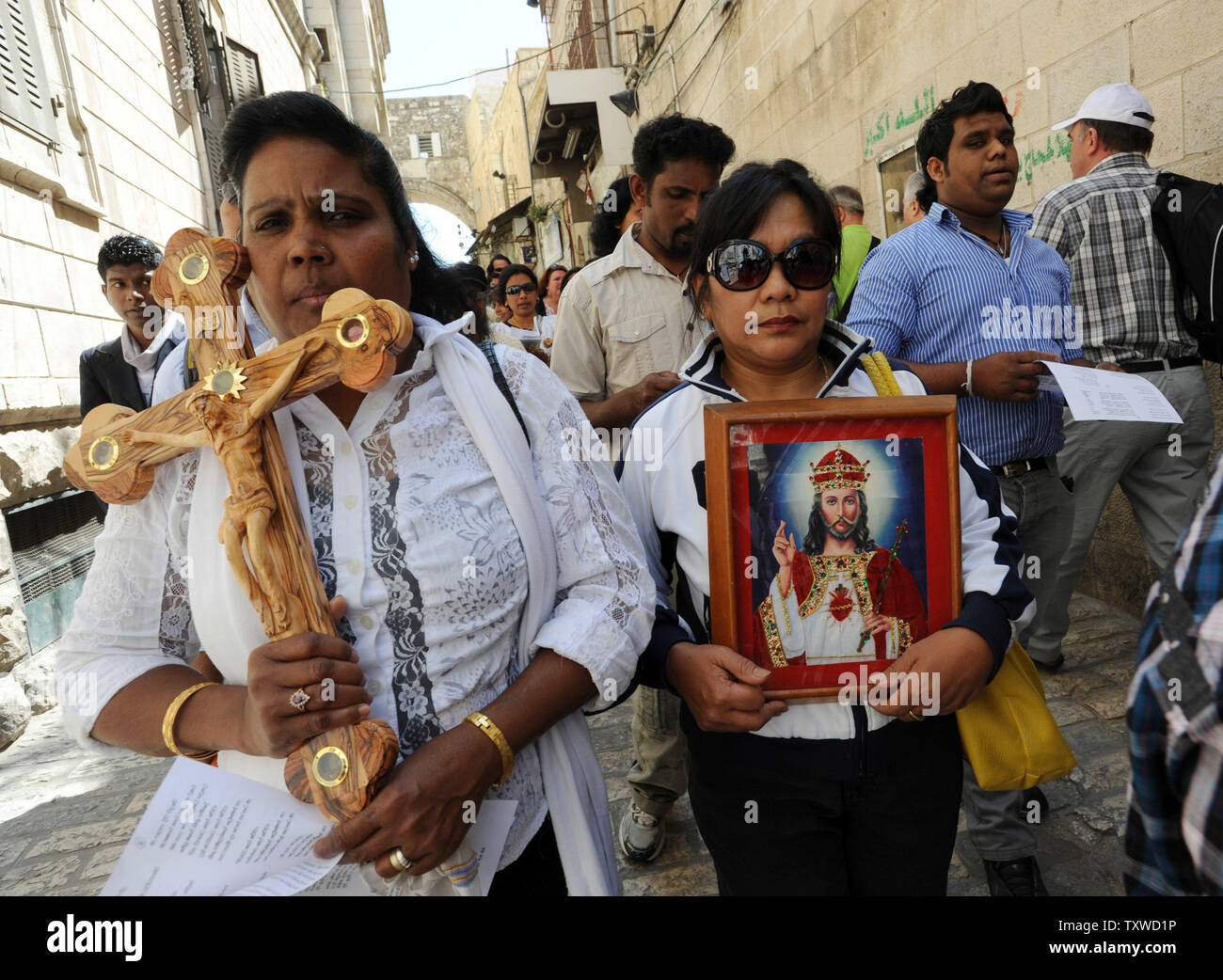 Christian Pilgrims Carry A Cross On The Via Dolorosa The Way Of