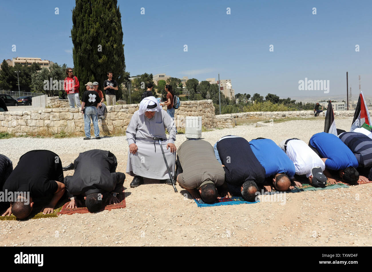 Palestinian Parry Palestinians pray on Mt. Scopus, near Hebrew University in Jerusalem ...