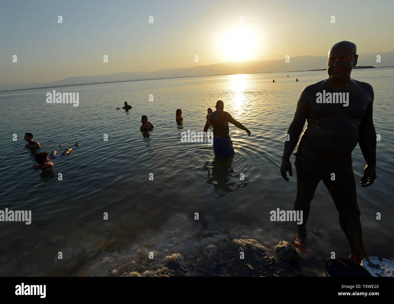 Israeli and international environmental social activists participate in a protest float at dawn against the deterioration of the Dead Sea, in an event organized by U.S. photographer Spencer Tunick, not seen, at Ein Bokek, Israel, September 14, 2012. UPI/Debbie Hill Stock Photo
