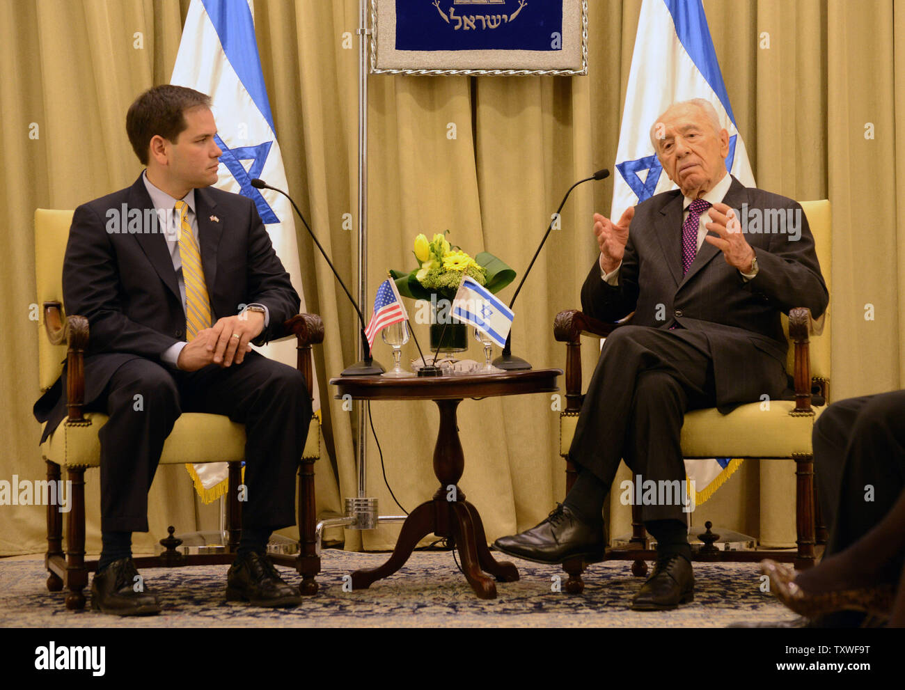 Sen. Marco Rubio (R-FL) (L) speaks with Israeli President Shimon Peres (R) before a diplomatic work meeting, February 20, 2013, at Peres' residence in Jerusalem, Israel.  UPI/Debbie Hill. Stock Photo