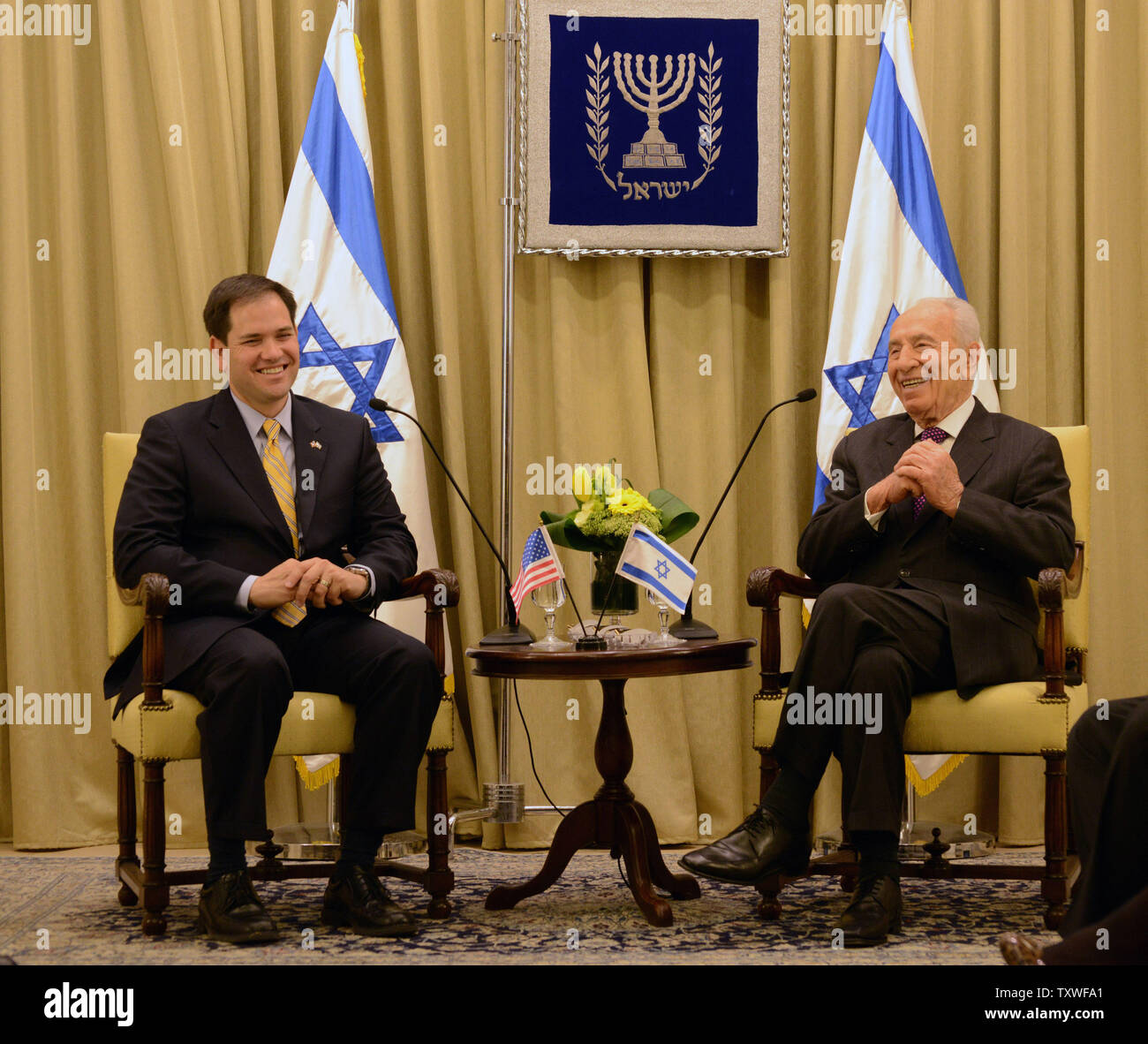 Sen. Marco Rubio (R-FL) (L) laughs with Israeli President Shimon Peres (R) before a diplomatic work meeting, February 20, 2013, at Peres' residence in Jerusalem, Israel.  UPI/Debbie Hill Stock Photo