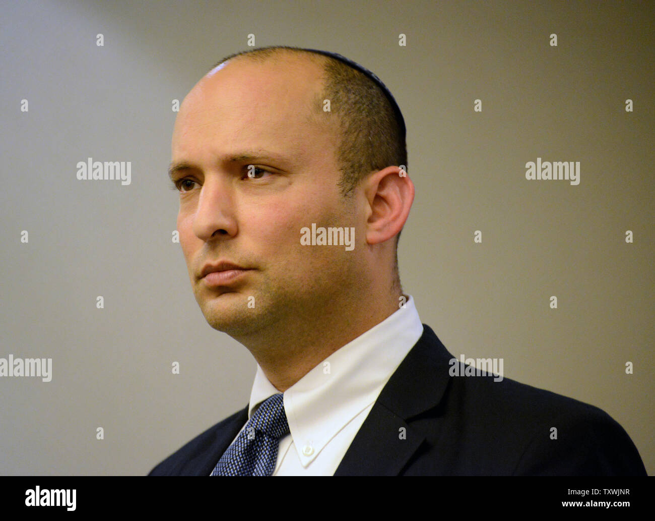 Israeli Minister of Economic Affairs and head of the far-right Bayit Yehudi, or Jewish Home Party, Naftali Bennett addresses the Foreign Press Association, which represents the international news media in Israel, at the King David Hotel in Jerusalem, April 27, 2014. Bennett said the Oslo era is ending and that he favors a brand of Palestinian self-rule that falls short of full-fledged statehood.   UPI/Debbie Hill Stock Photo
