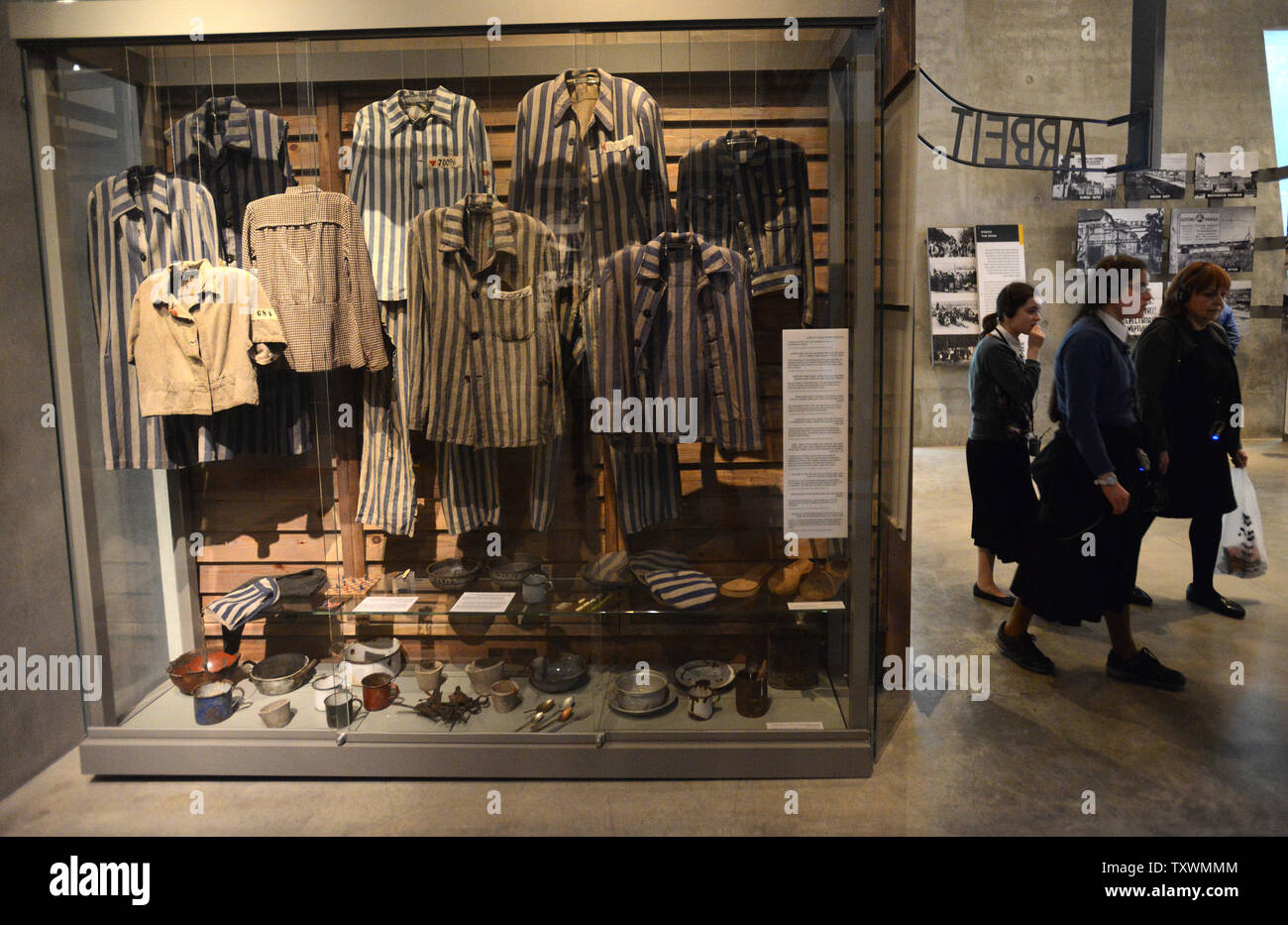 Visitors walk by a display of concentration camp uniforms worn by Jews during the reign of Nazi Germany in War World II, which resulted in the mass murder of six million Jews, in the Yad Vashem Holocaust Museum in Jerusalem, Israel, January 25, 2015. International Holocaust Day will be marked on January 27, the date in 1945 when the Auschwitz-Birkenau concentration camp was liberated by Soviet forces. Photo by Debbie Hill/UPI Stock Photo