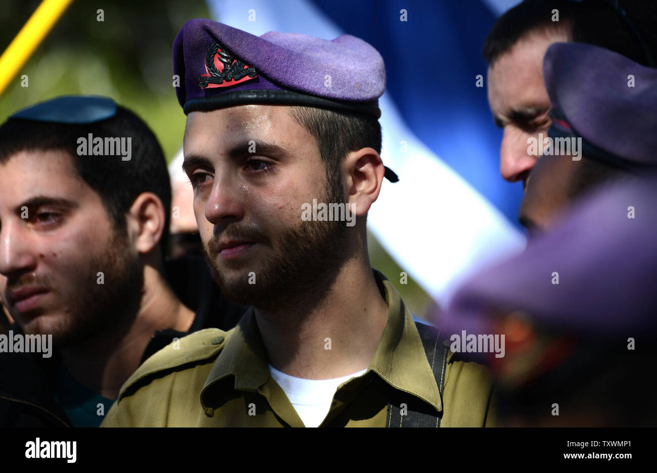 Israeli soldiers weep during the funeral of Major Yochai Kalangel, 25, at the Mt. Herzl Military Cemetery in Jerusalem, Israel, January 29, 2015. Kalangel was one of two soldiers killed by Lebanon's Hezbollah militants yesterday, when  an anti-tank missile struck an Israel Defense vehicle on patrol near the border with Lebanon in northern Israel. He leaves behind a wife and a one year old daughter. Photo by Debbie Hill/UPI Stock Photo