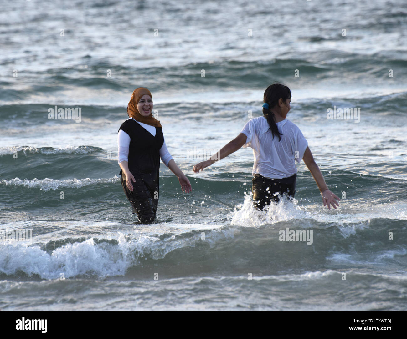 Muslim Palestinians play in the Mediterranean Sea in Tel Aviv, Israel, on the third day of the Eid al-Adha, Feast of Sacrifice, September 26, 2015. Eid al-Adha honors the willingness of Abraham (Ibrahim) to sacrifice his son Ishmael before God intervened.   Photo by Debbie Hill/ UPI Stock Photo