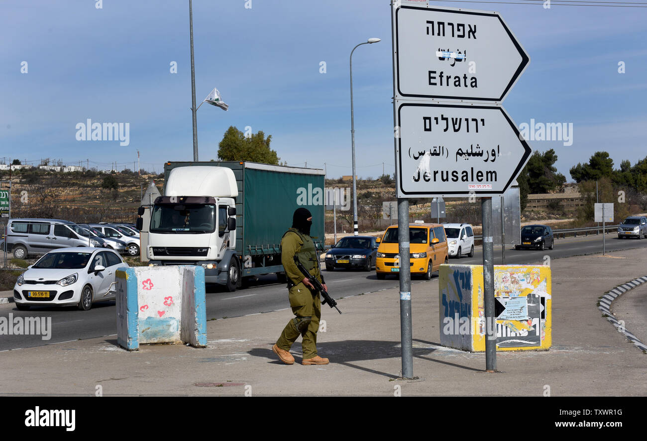 An Israeli soldier from the elite infantry unit stands guard at the Gush Etzion Junction in the West Bank on the road between Jerusalem and Hebron, January 5, 2016, after a Palestinian stabbed an Israeli soldier. Israel has fortified the junction with barriers and increased soldier presence after multiple stabbings and car ramming attacks by Palestinians on Israelis since October.  Photo by Debbie Hill/ UPI Stock Photo