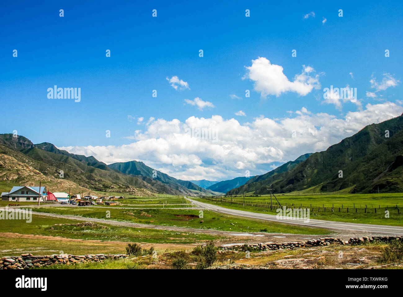Scenic mountain road trip in sunny day Stock Photo