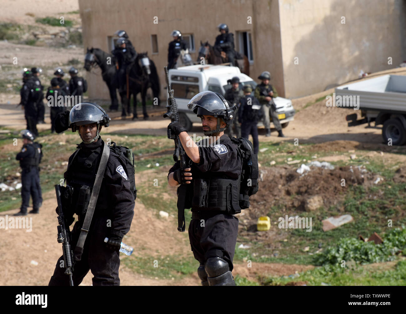 Israeli police special forces stand guard after demolishing houses in the  unrecognized Bedouin village of Umm al-Haran, in the Negev, near the  southern city of Beer Sheva, Israel, January 18, 2017. Violent