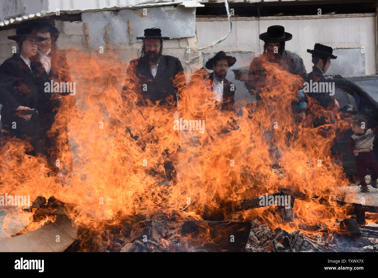 Ultra-Orthodox Jews burn leaven food products in preparation for the Jewish holiday of Passover in the Mea Shearim neighborhood in Jerusalem, Israel, April 10, 2017. Jews eat matzah, unleavened bread, during the eight days of Passover that celebrates the Biblical story of the exodus of the Israelites from slavery in Egypt.  Photo by Debbie Hill/UPI Stock Photo